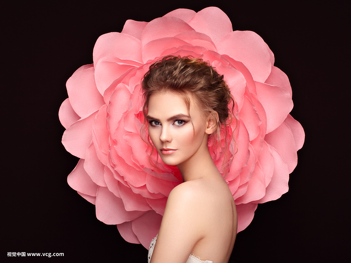 Beautiful woman on the background of a large flower