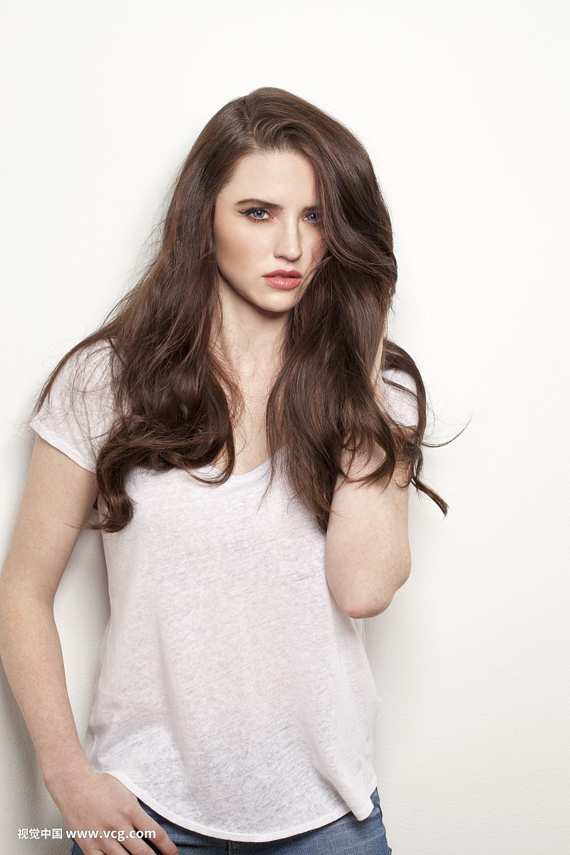 Studio portrait of young brunette woman