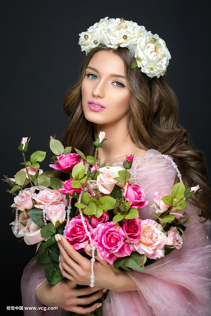 beautiful girl with pink makeup and flowers