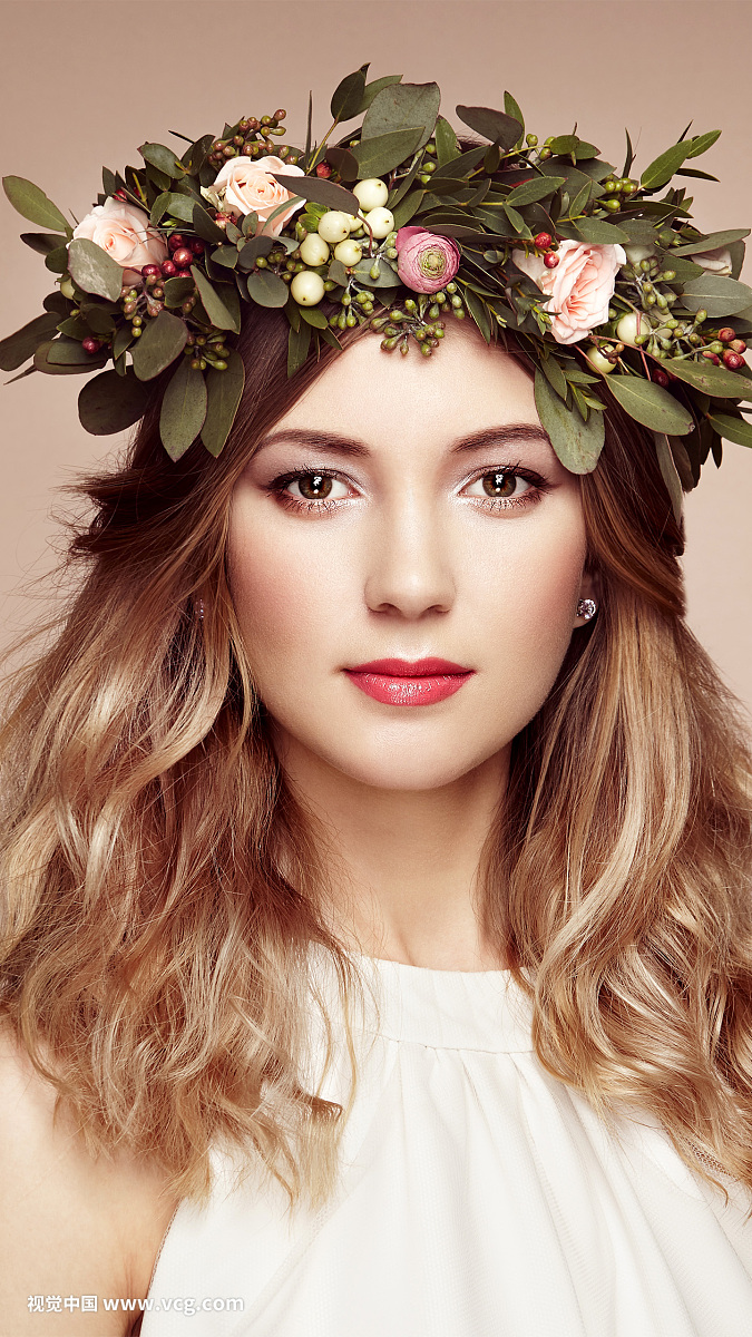 Beautiful blonde woman with flower wreath on her head