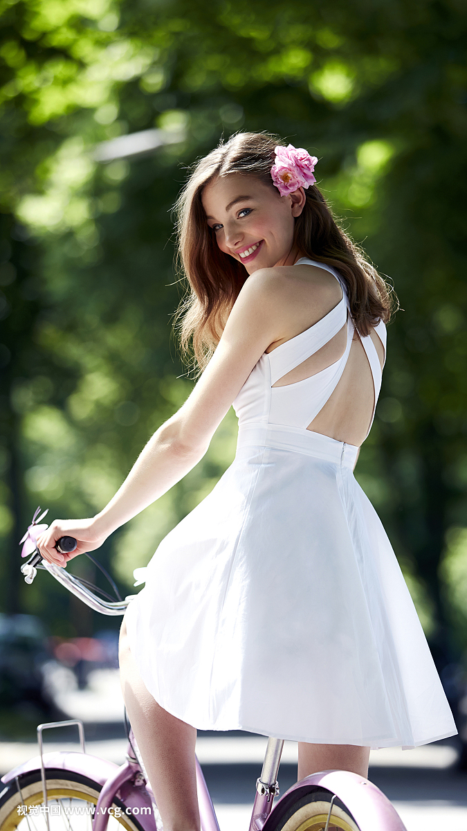 Young woman with bicycle