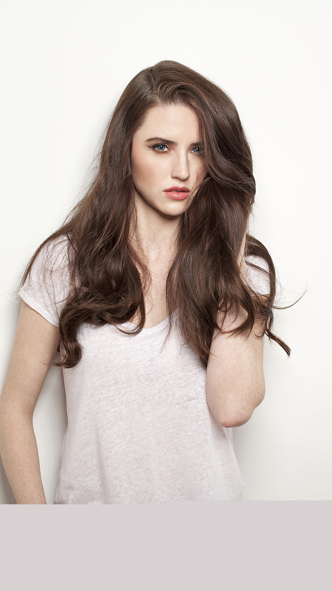 Studio portrait of young brunette woman