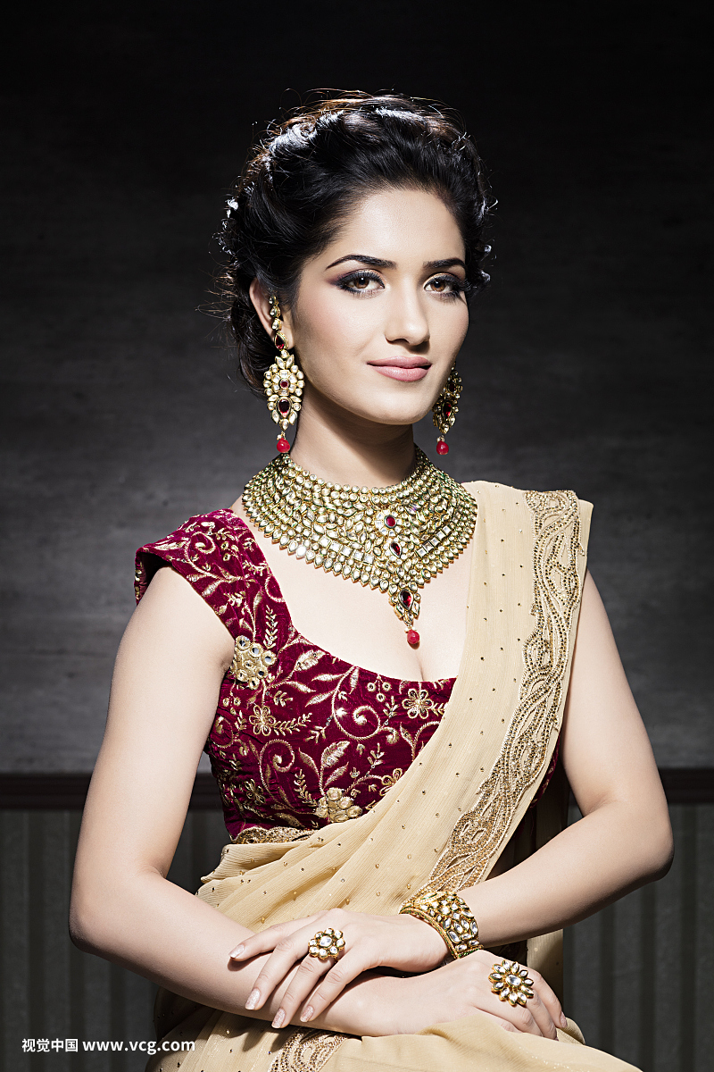 Young woman wearing jewellery, portrait