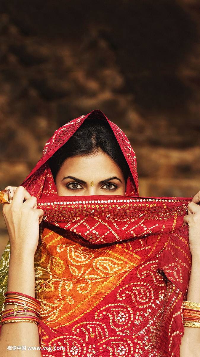 woman with sari covering face